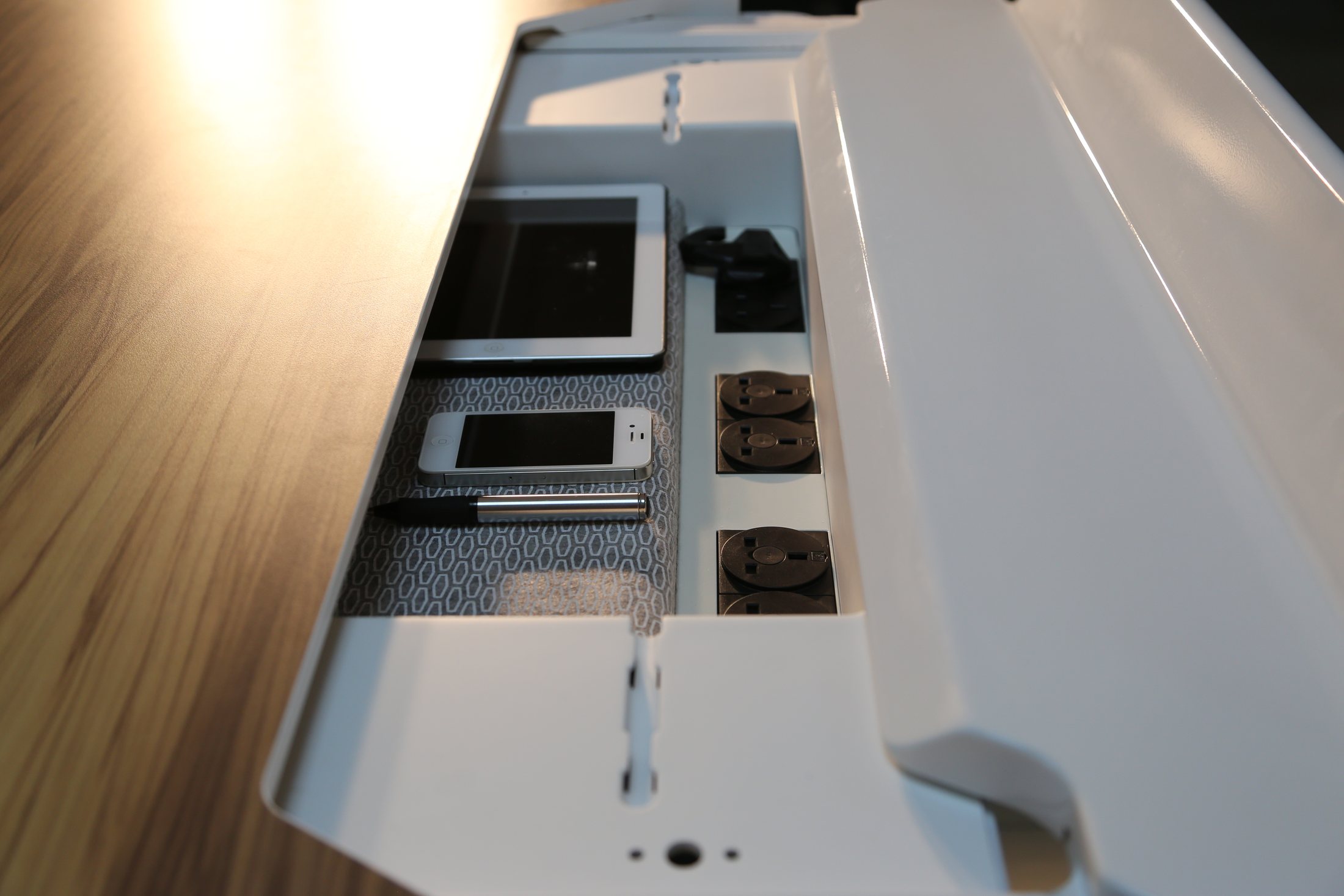 Integrated personal storage inside the Herman Miller T2 table